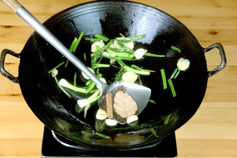 Saute the aromatics, such as ginger and scallions, before braising the pork knuckle can improve the flavor.