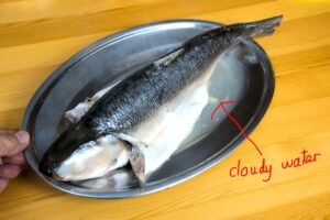 Steam the fish and discard the cloudy water.