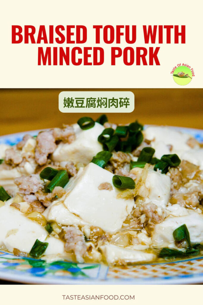 Cantonese style braised tofu with minced pork in a light brown sauce, topped with fresh green onions.