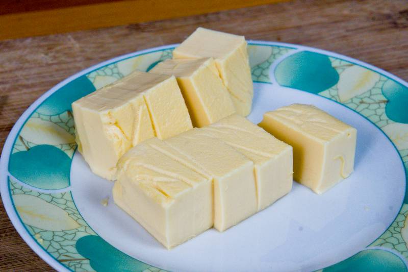 Homemade egg tofu cut into cubes and ready for cooking or serving