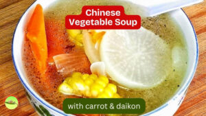 Chinese vegetable soup with daikon, carrot, sweet corn and onion in clear chicken broth
