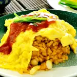 Omurice (オムライス, Omu-raisu) is a Japanese cuisine consisting of ketchup-based fried rice and omelet.