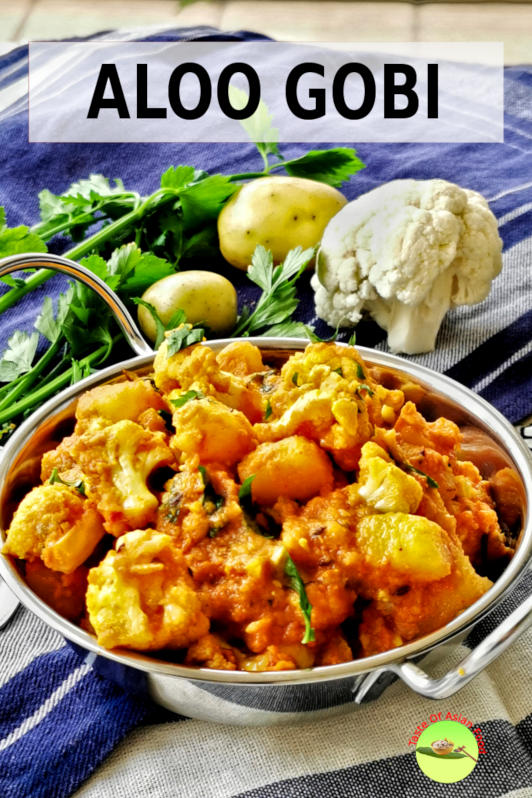 Aloo gobi (alu gobi) is a classic Indian vegetarian dish made with potatoes and cauliflower.  It is usually cooked with some spices and with onion and tomatoes.
