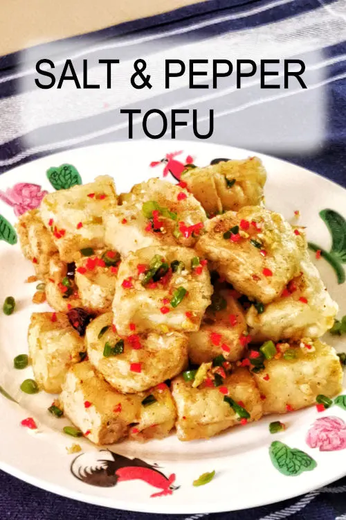 Salt and pepper tofu. It has a crispy exterior and a load of flavor from the savory seasoning. An authentic Chinese recipe.
