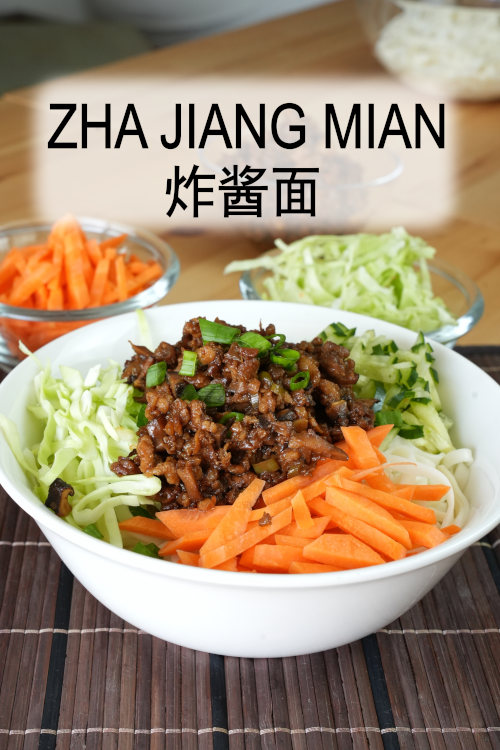 Zha Jiang Mian (Beijing fried sauce noodles, 炸酱面) is prepared with made a meat sauce comprised of soybean paste 黄豆酱 and sweet bean paste 甜面酱, coupled with crunchy vegetables.
