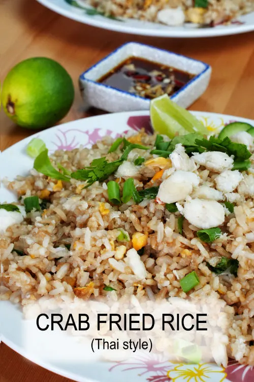 Crab fried rice Thai style  ข้าวผัดปู, a delicious quick meal with fish sauce, crab meat, and high heat to create the wok aroma.