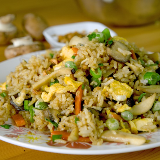 Mushroom fried rice  with egg, carrot and peas