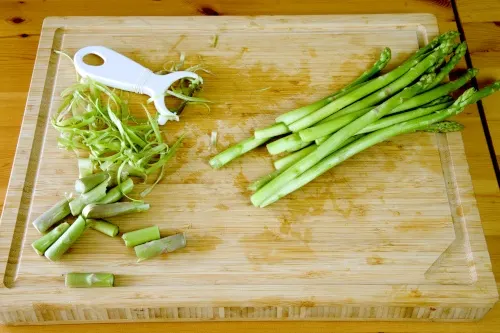 Remove the tough, stringy exterior of the asparagus