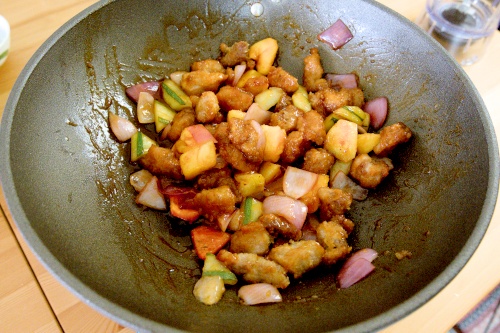 Mix the pork with the vegetables before serving.