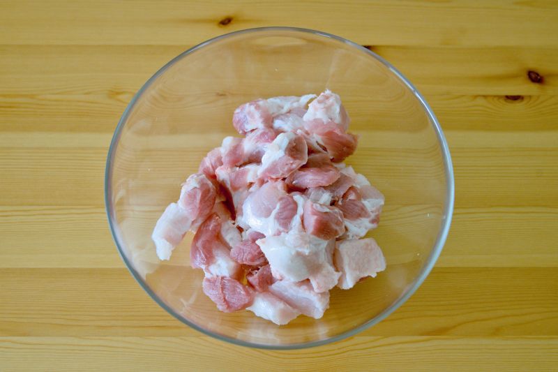 Cut the pork into one inch pieces to prepare deep fried pork