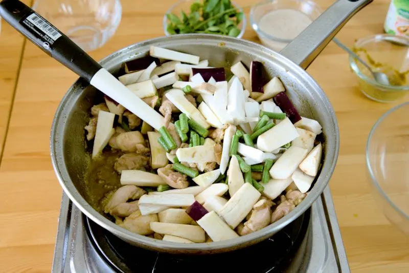 Add the king oyster mushroom and eggplant to the curry.