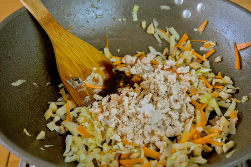 Season the spring roll filling with light soy sauce, oyster sauce, salt, and pepper.