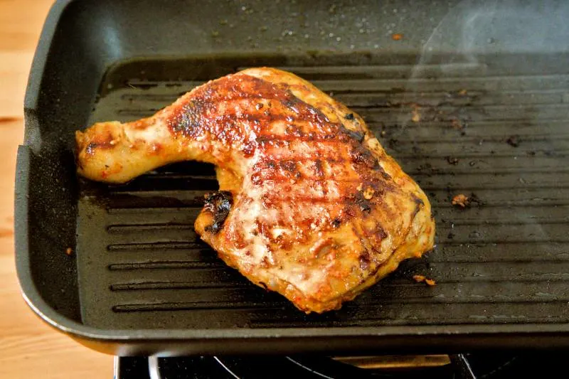 Grill the peri-peri chicken, then finish it in the oven