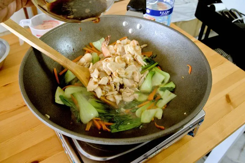 Season the Yi Mein noodles with light soy sauce, oyster sauce, salt, white pepper, and Shaoxing wine