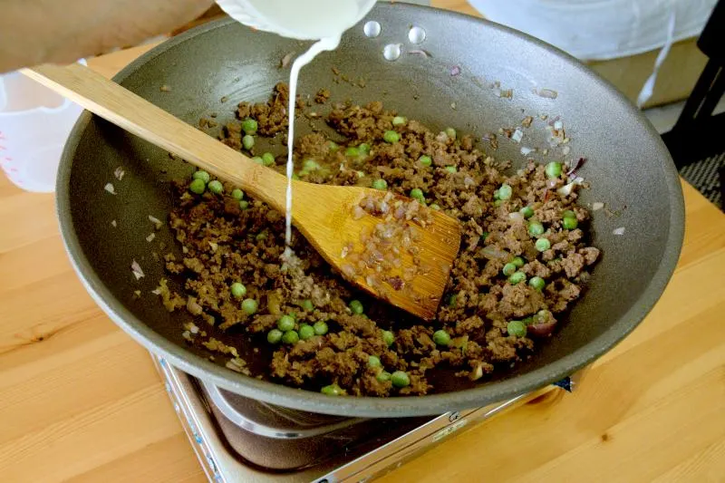 Thicken the sauce with cornstarch slurry.