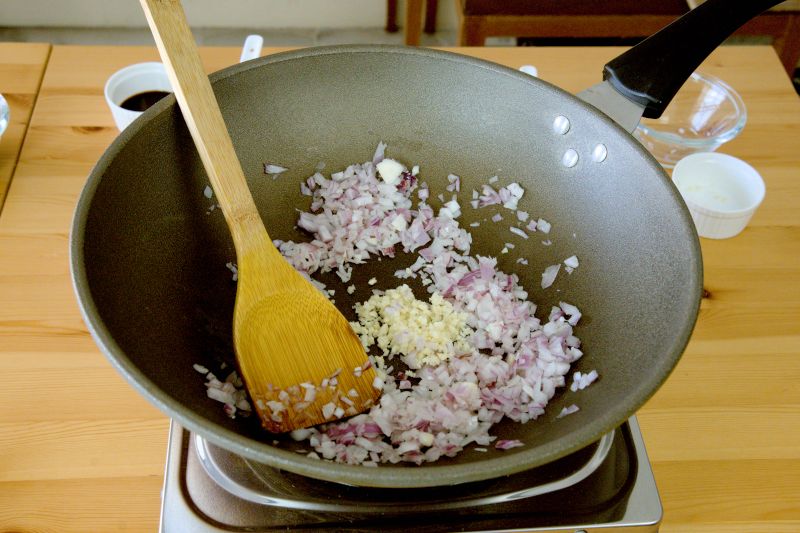 saute the onion and garlic to make ground beef rice