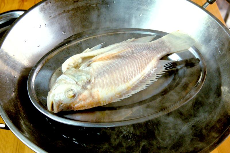 Steam the fish over high heat with rolling boiling water for approximately 8 minutes