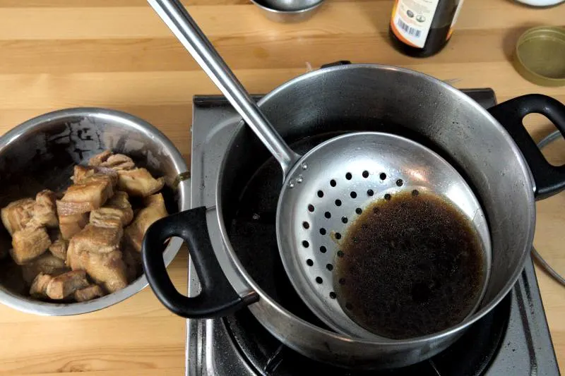 Strain the remaining braising liquid to remove all the solids