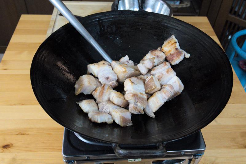 Browning the pork before braising