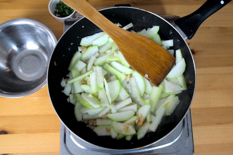 Stir fried the fuzzy melon until crisp tender