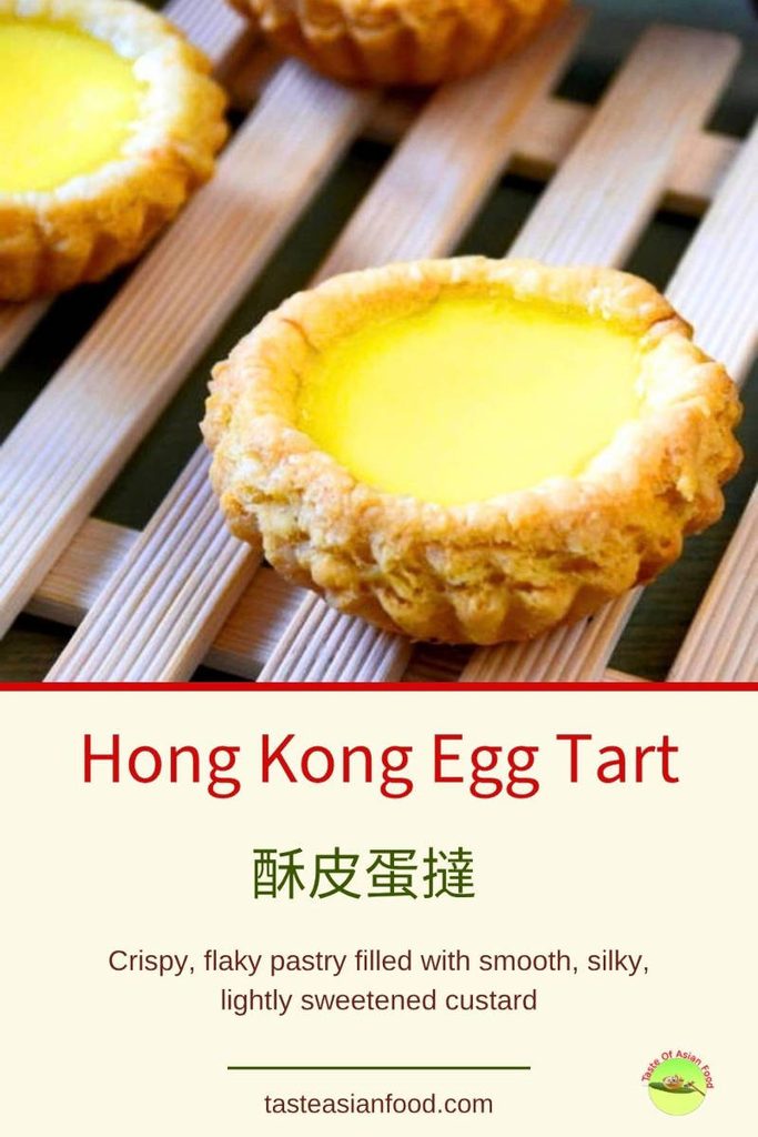 Freshly baked Hong Kong-style egg tarts with golden pastry shells and smooth yellow custard